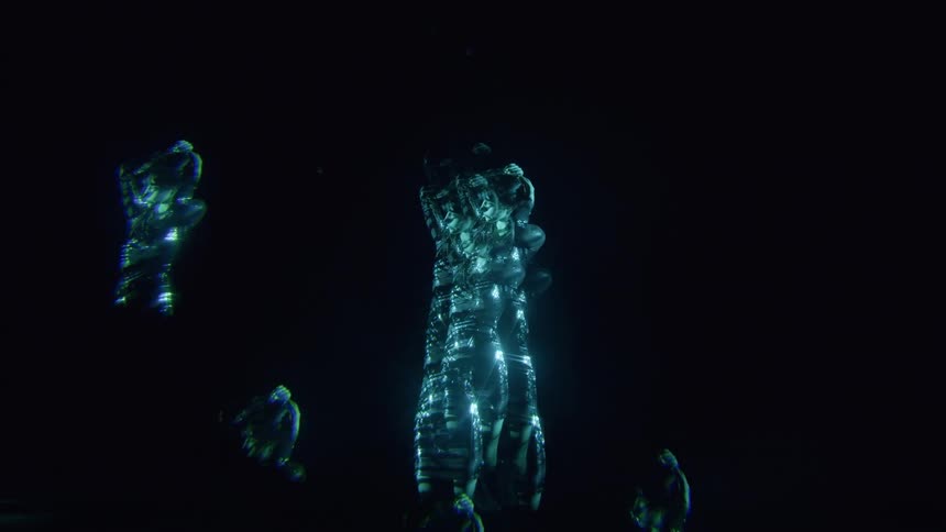 Woman in a dark room in multiple exposures with a lighted outfit