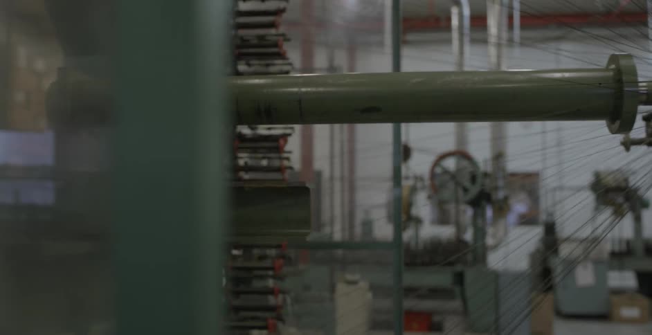 A factory machine spins and rotates
