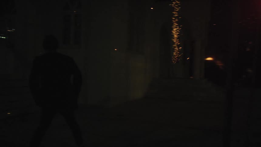 Fireworks explode around a man