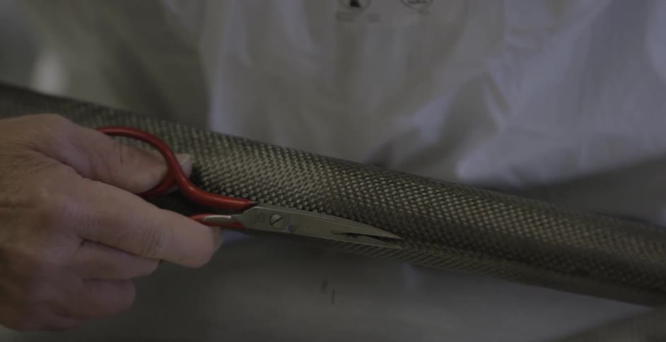 Scissors are used to trim material from a tube
