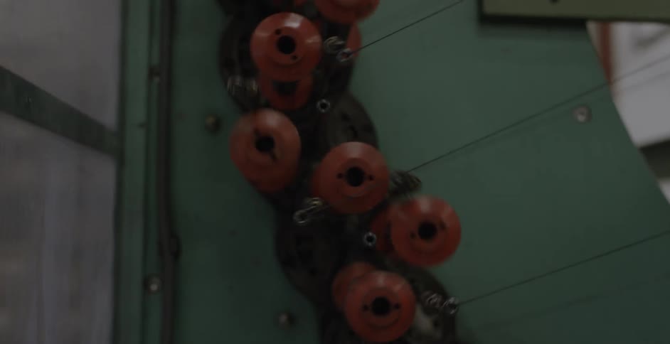 A weaving machine rotating and pulling thread