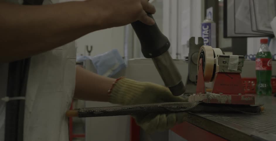 Person making something in a workshop