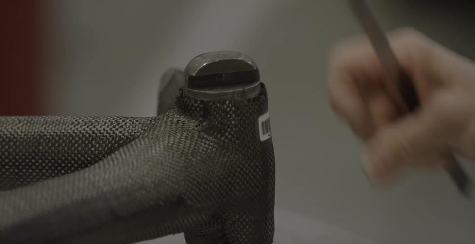A person puts a label on a device