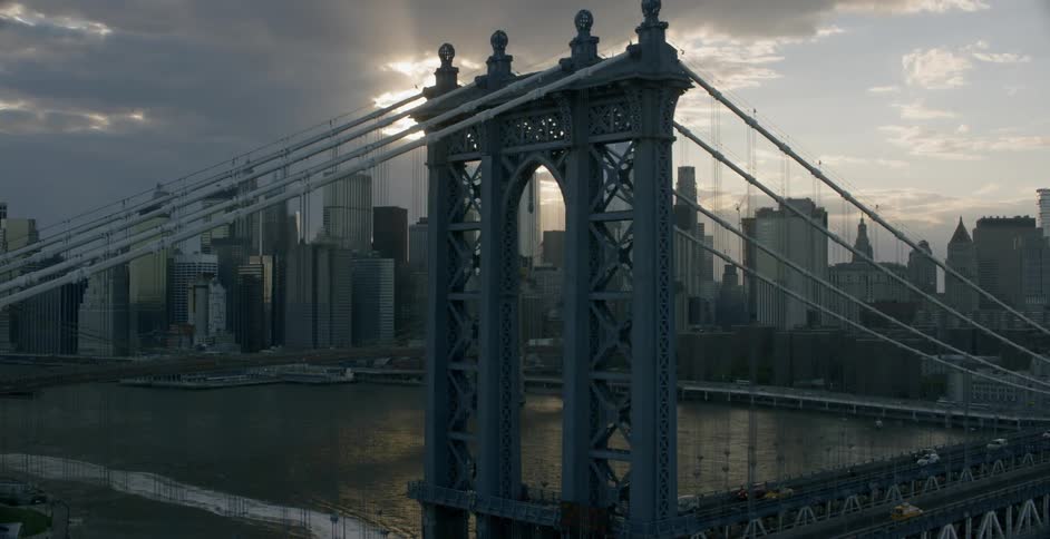 A city skyline and bridge on a cloudy day