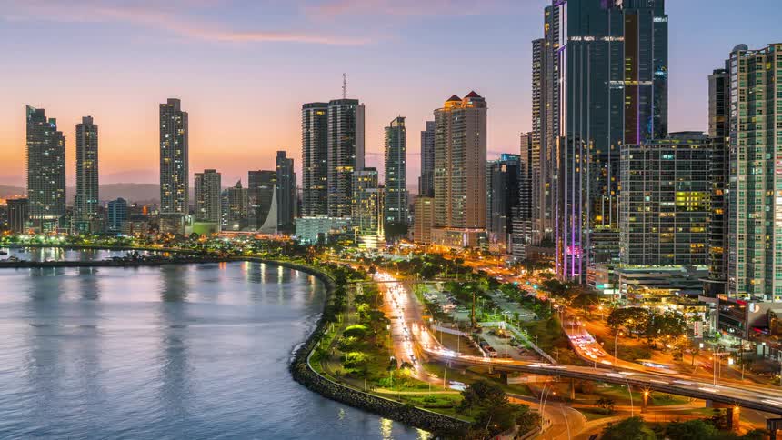 Panorama of a seaside metropolis with modern skyscrapers and highways with heavy vehicle traffic