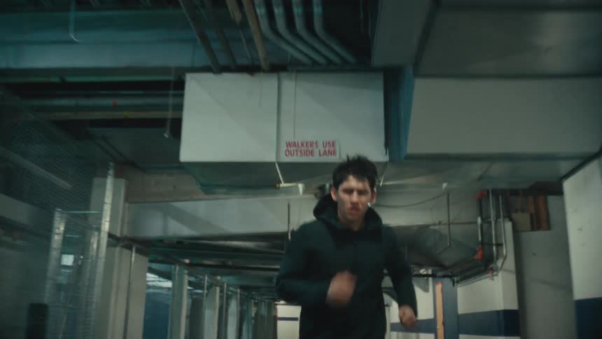 A man is running down the corridor