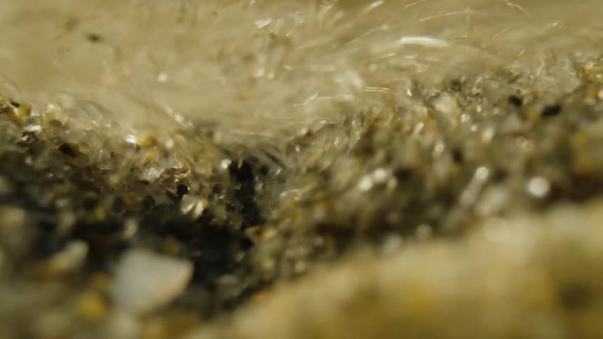 Several small crystallized stones falling and forming a pile of them