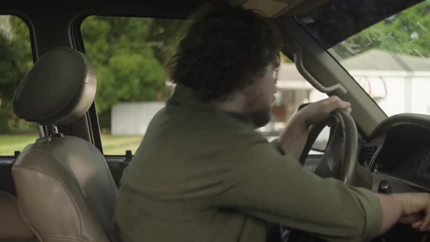 Man running inside car and quickly driving off