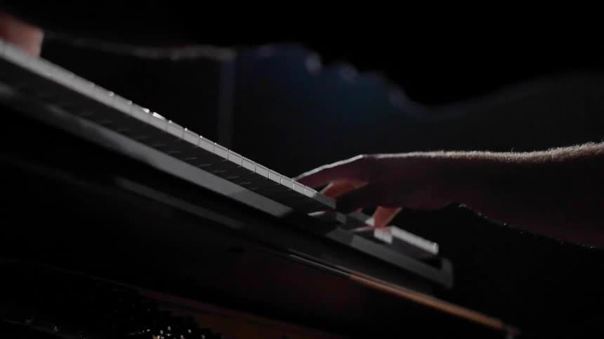 Hands of a person playing the piano