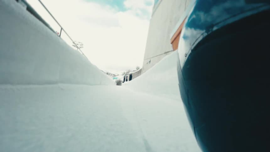 An ice rink that is passing quickly through a skeleton platform