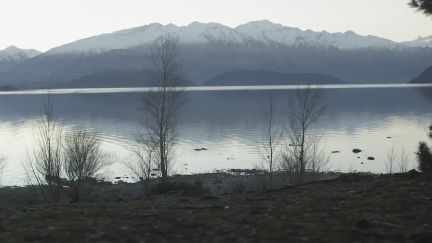 View of a lake with snowy mountains in the background