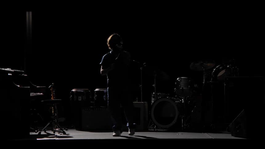 A clip of a musician practicing on stage