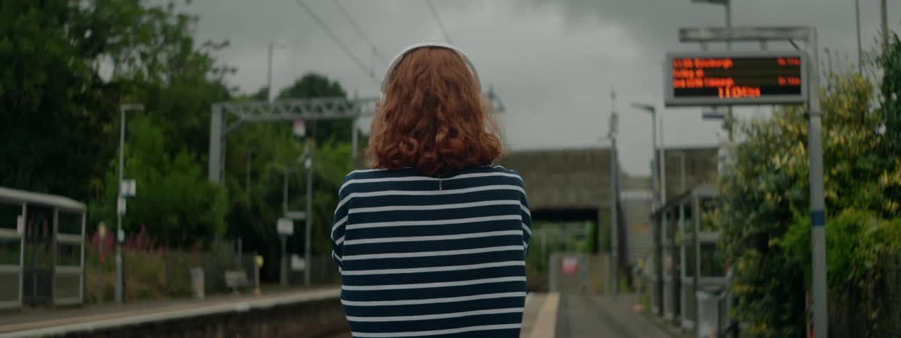 A back view of a lady standing