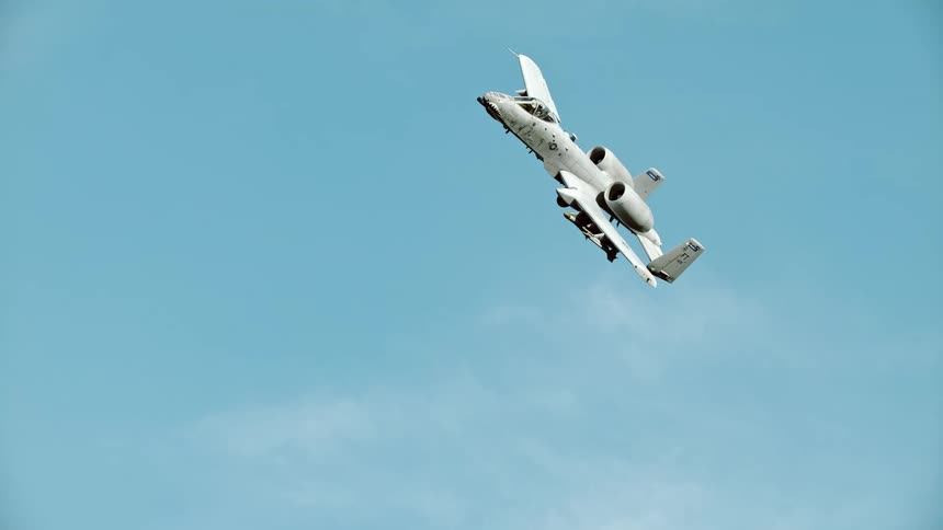 Jet in flight against blue skies and clouds