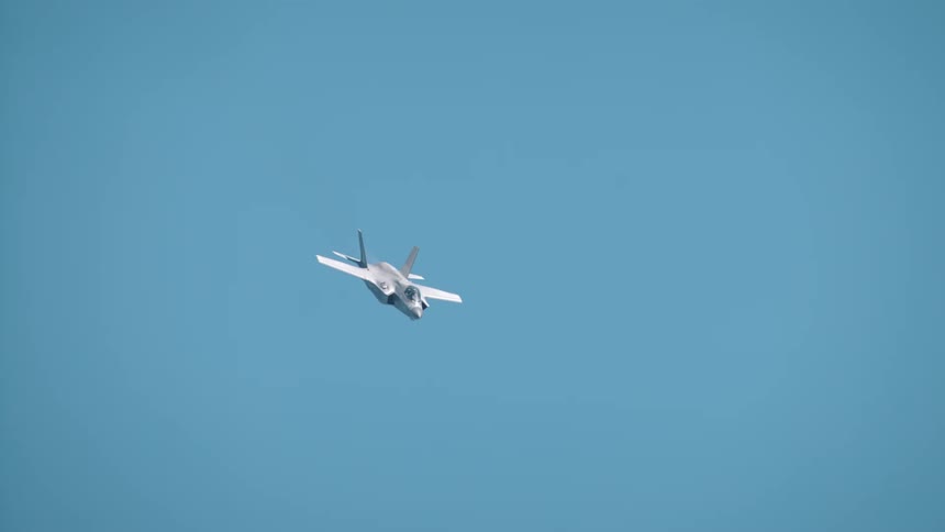 A jet is nose diving in the sky