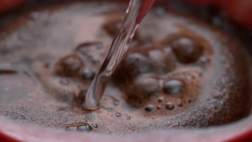 Soda is poured into a cup