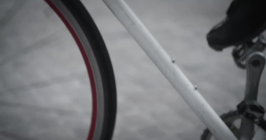 A person is pedaling their bicycle