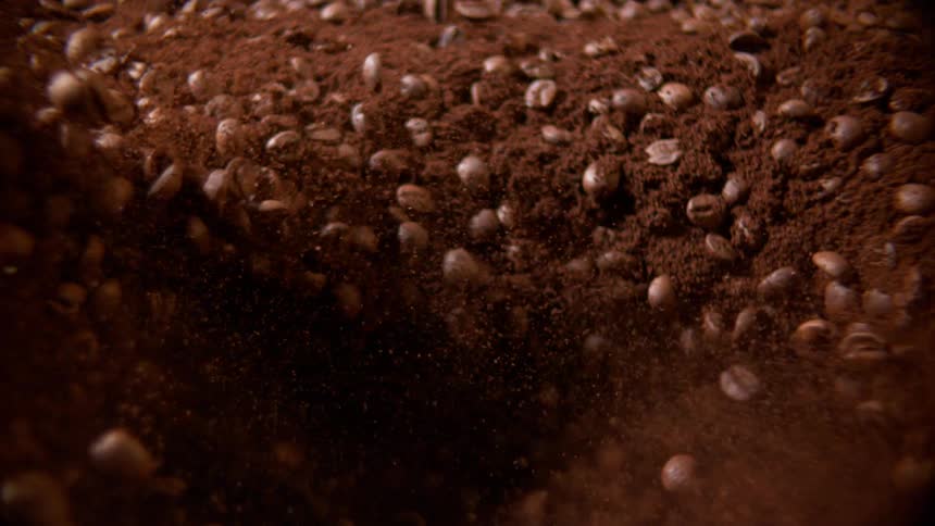 Coffee seeds turning into powder in a rotating motion