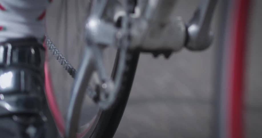 A cyclists foot pedals a bike