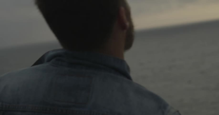 A person throwing rocks into the water