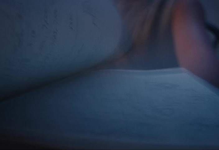 Person turning pages of a book
