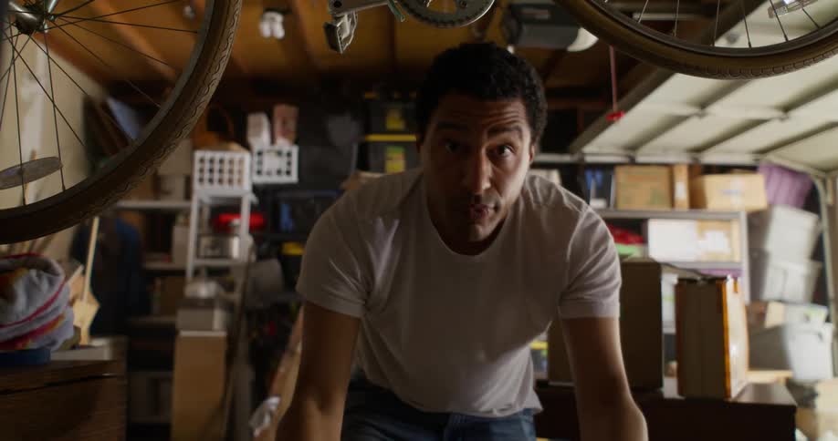 A man stores a box in his garage