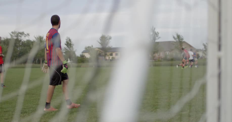 A group of guys are playing soccer