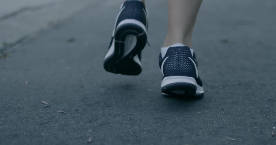 A person is running down a street