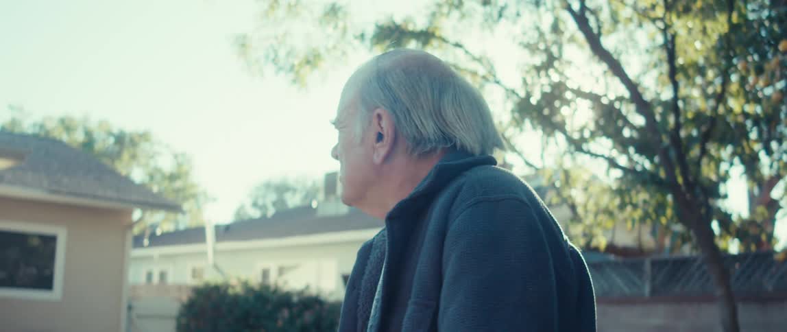 Elderly man walking outdoors