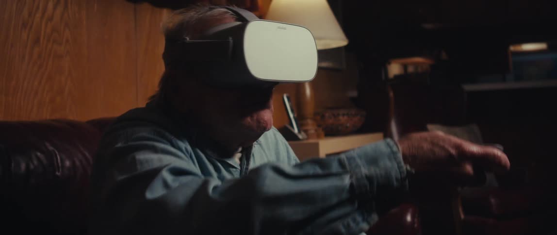 Person sitting using virtual reality glasses