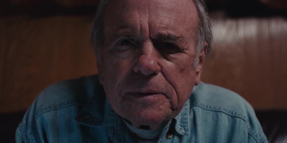 Elderly man sitting and concentrating