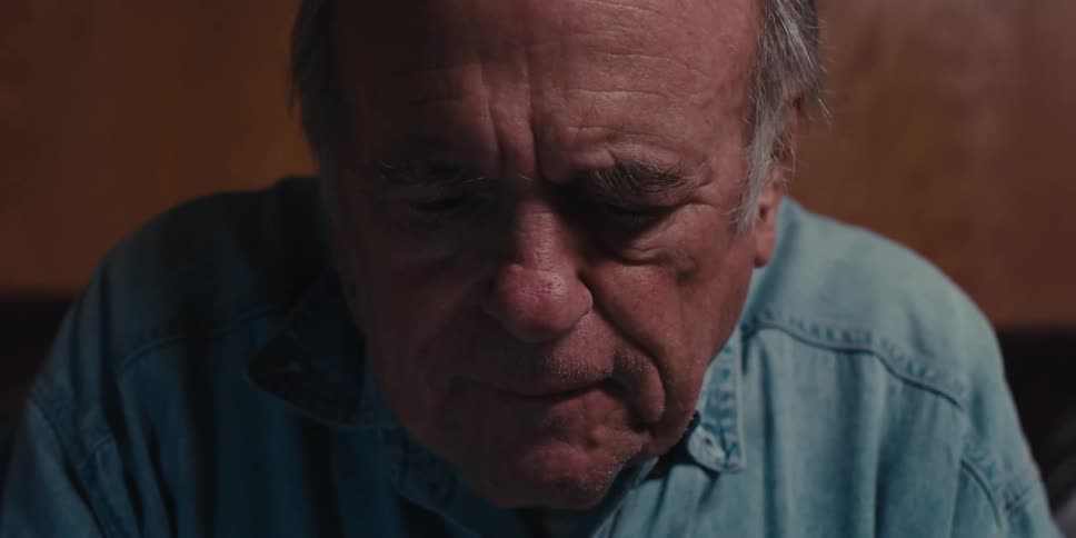 Elderly man typing on a keyboard