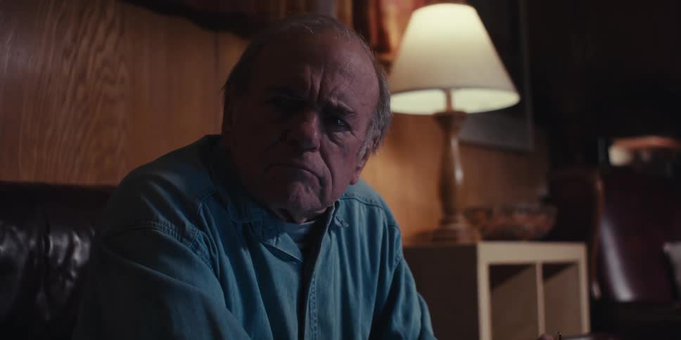 Elderly man sitting in a room