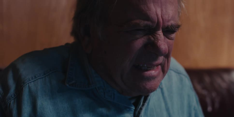 A man looks angry at something he is looking at