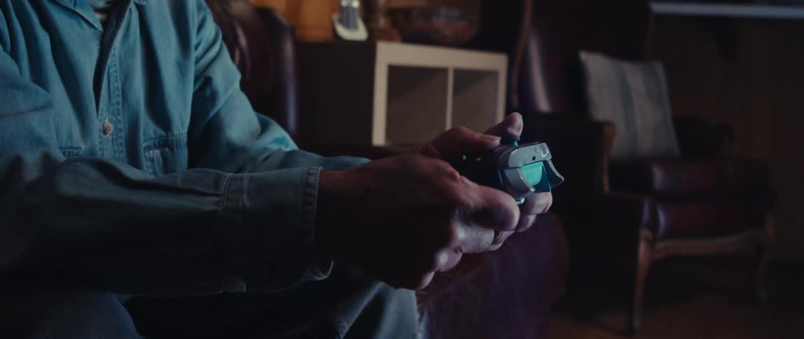 A man is playing video games at home