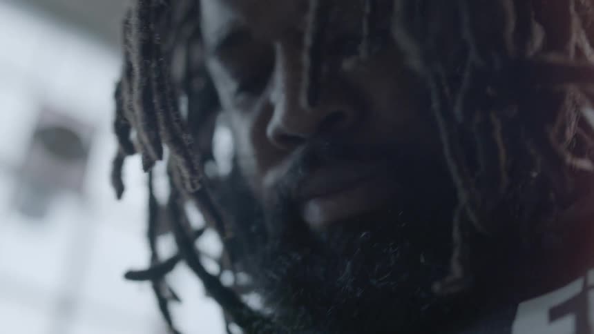 A man with dreadlocks is out of breath