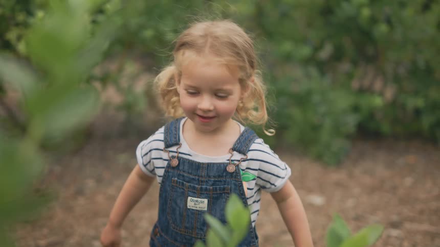 A child is eating on the farm
