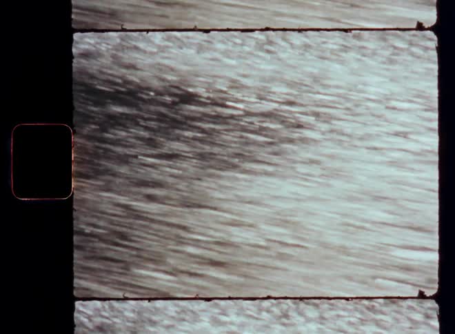 View of moving water with reflection of the sun