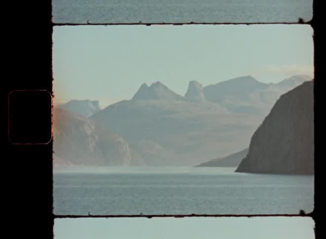 Landscape of the sea surrounded by mountains