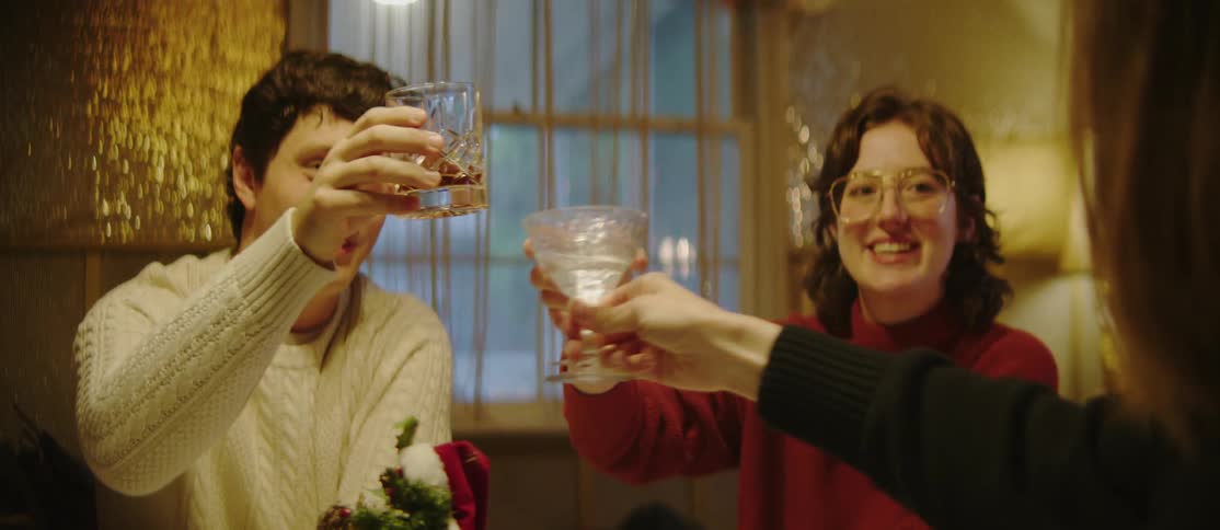 People sitting at a table toasting