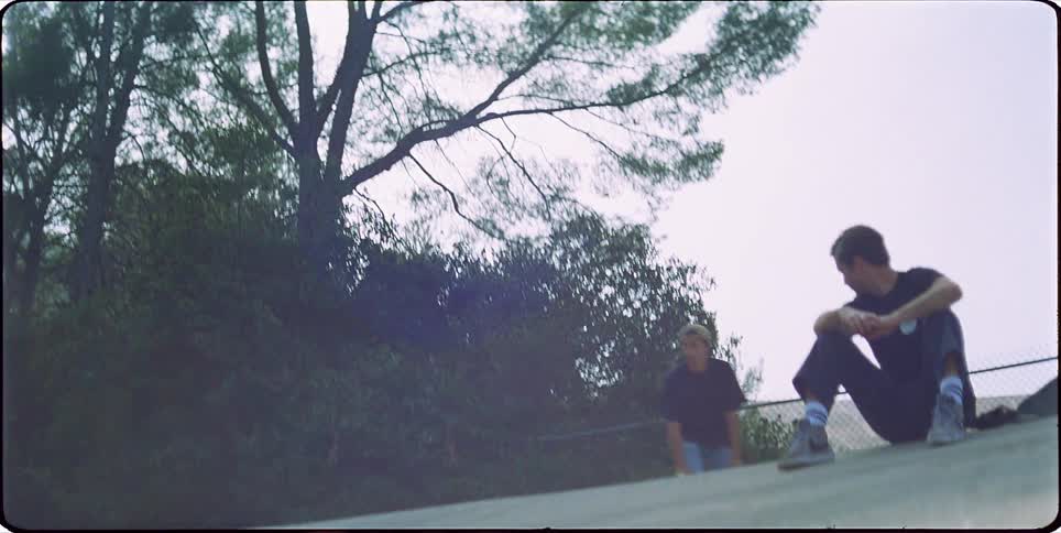 Young man skateboarding down a ramp