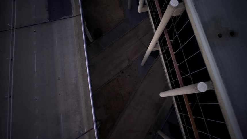 A motorcycle drives under the overpass