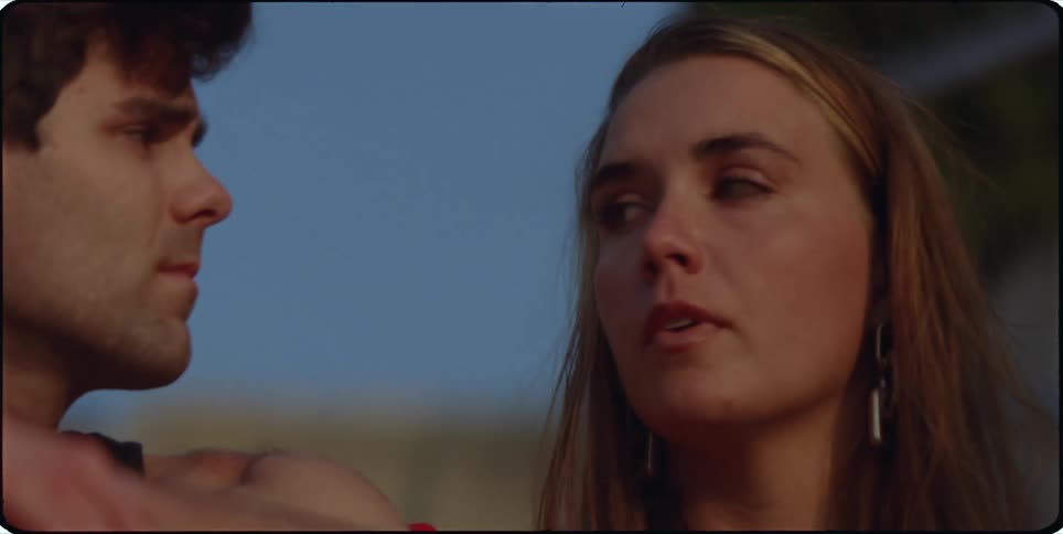 Portrait of a man and a woman looking at each other
