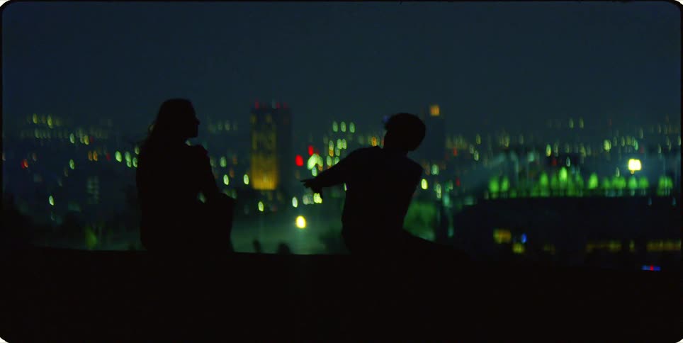 A night clip of a couples holding hands