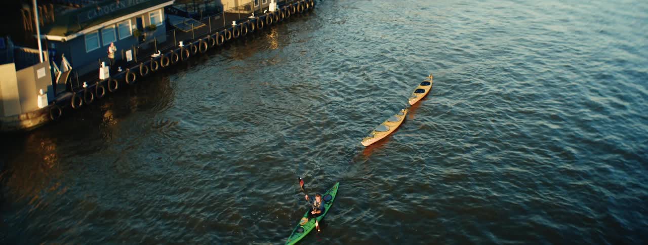 Aerial view of a person canoeing in a sea canal