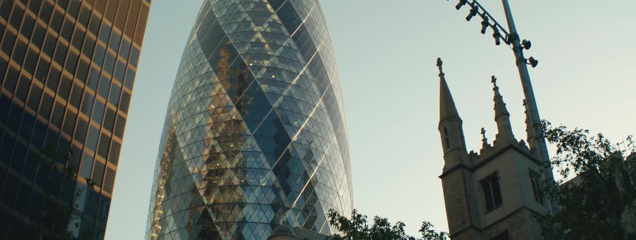 Modern spiral building next to a cathedral