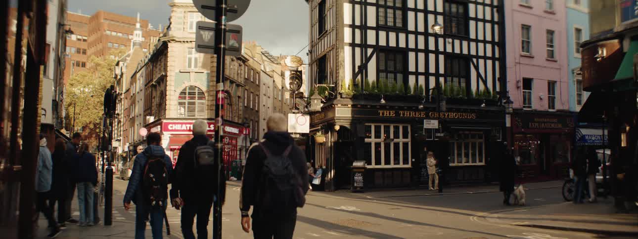 The busy city has many pedestrians walking around