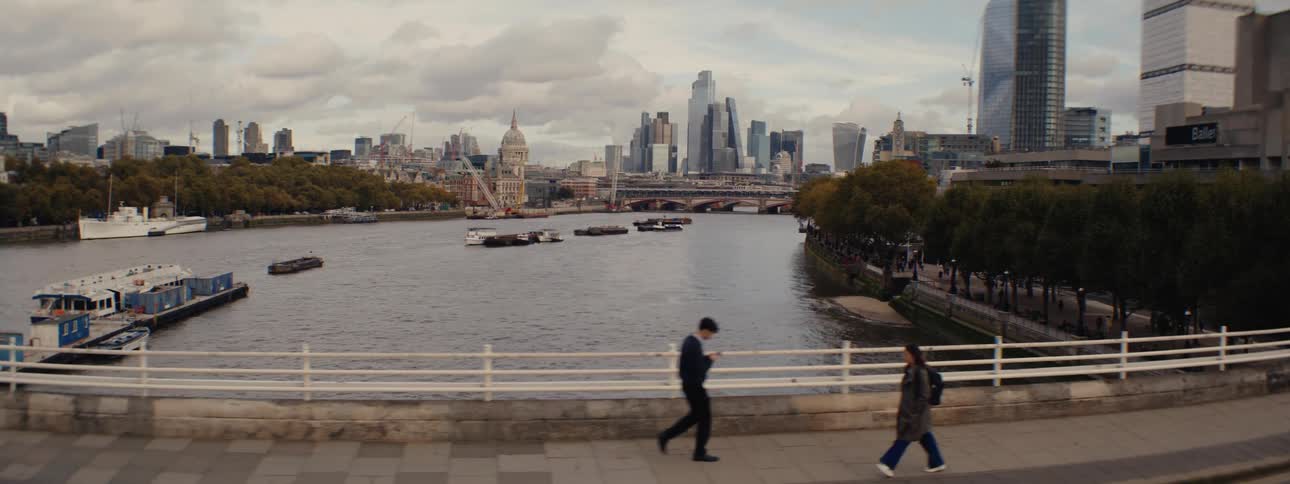 People walk over the bridge in the city