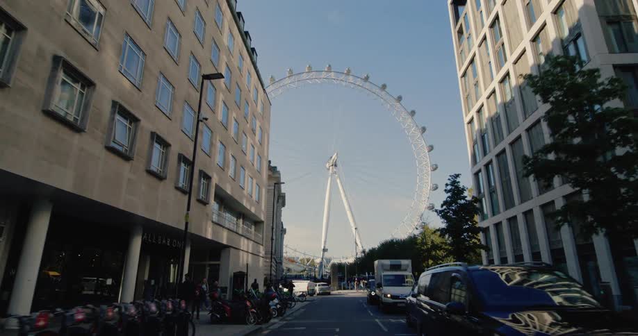 A large ferris wheel is at the end of the road
