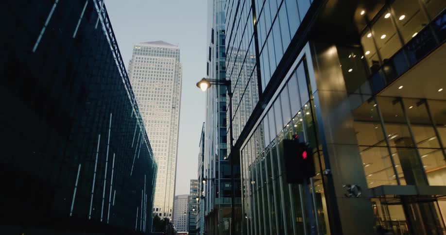 Busy street with vehicle traffic and surrounded by modern skyscrapers